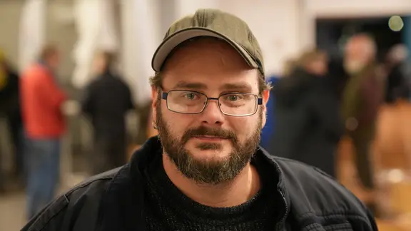 Portrait d'un homme lors de l'événement public sur la réhabilitation de la B76.