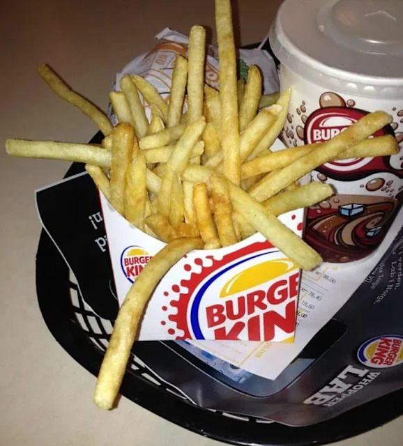 Des frites de Burger King avec un gobelet de boisson